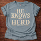 Stone Blue He Knows His Herd Christian shirt John 10:14 Bible verse t-shirt with vintage typography design