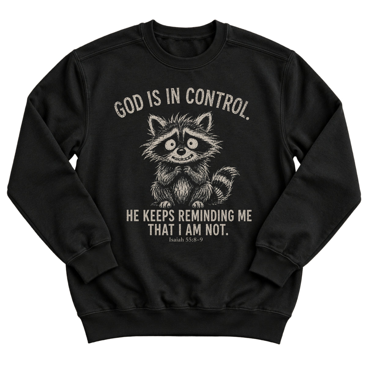 Black crewneck sweatshirt with a nervous, wide-eyed raccoon illustration and the words God Is In Control. He Keeps Reminding Me That I Am Not. Isaiah 55:8-9