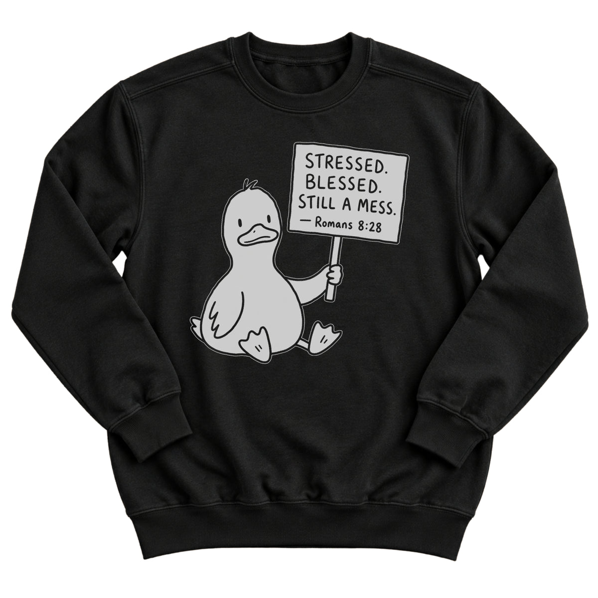 Black crewneck sweatshirt with a cartoon duck sitting and holding a sign that reads Stressed. Blessed. Still A Mess. Romans 8:28