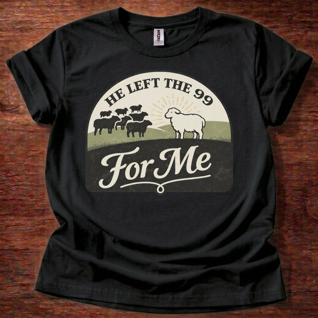 Black t-shirt with graphic design and text on a wooden surface
