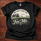 Black t-shirt with graphic design and text on a wooden surface