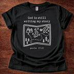 God is Still Writing T-Shirt