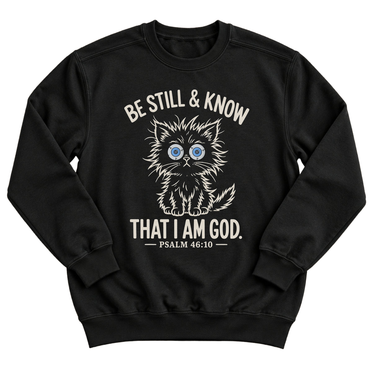Black crewneck sweatshirt with a wide-eyed fluffy kitten illustration and the words Be Still & Know That I Am God, Psalm 46:10