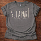 Charcoal Set Apart Christian t-shirt with simple cross and John 15:19 scripture design