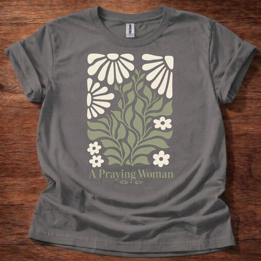 Charcoal t-shirt featuring a floral design with the phrase “A Praying Woman” printed on the front