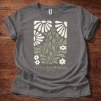 Charcoal t-shirt featuring a floral design with the phrase “A Praying Woman” printed on the front