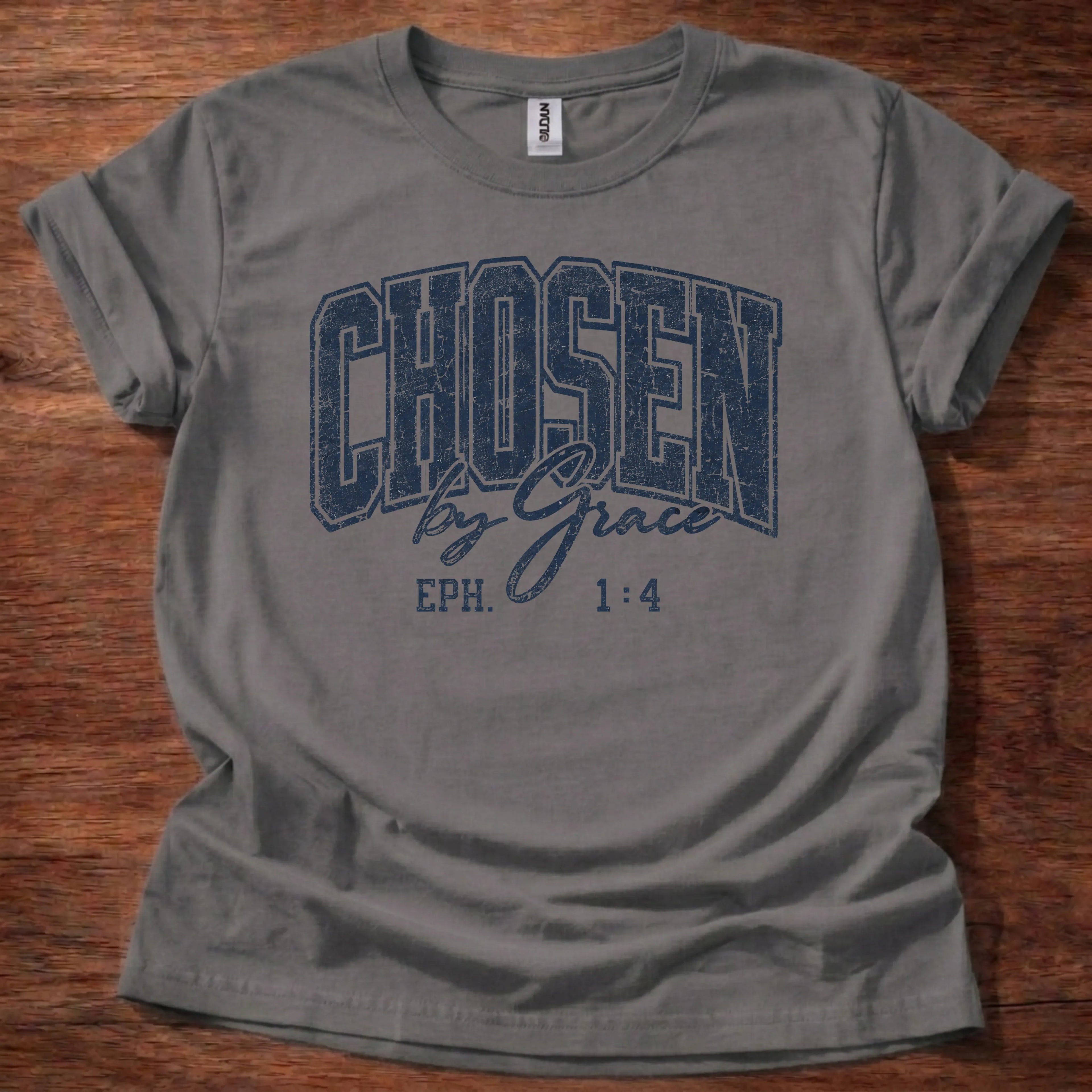 Navy distressed varsity-style t-shirt reading 'Chosen by Grace' with cursive script and Ephesians 1:4 citation