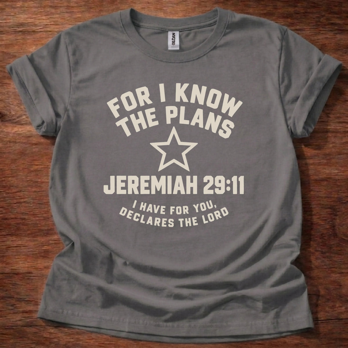 Cream star icon t-shirt with the text 'For I Know The Plans' arched above and 'Jeremiah 29:11' below