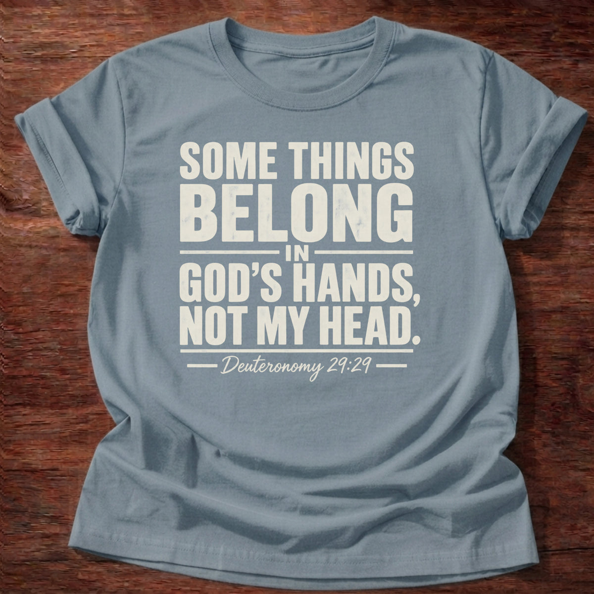 Stone blue t-shirt reading 'Some things belong in God's hands, not my head' Deuteronomy 29:29, a minimalist Christian shirt