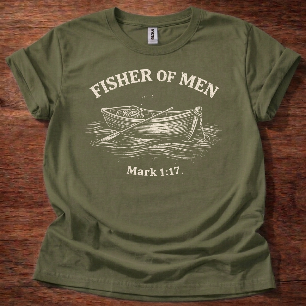 Green Fisher of Men t-shirt with a boat graphic and text on a wooden surface