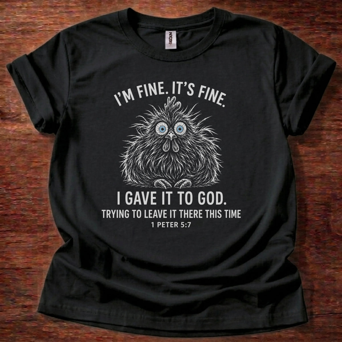 White fine-line chicken illustration t-shirt with the text 'I'm Fine. It's Fine. I Gave It To God. Trying To Leave It There This Time.' and 1 Peter 5:7