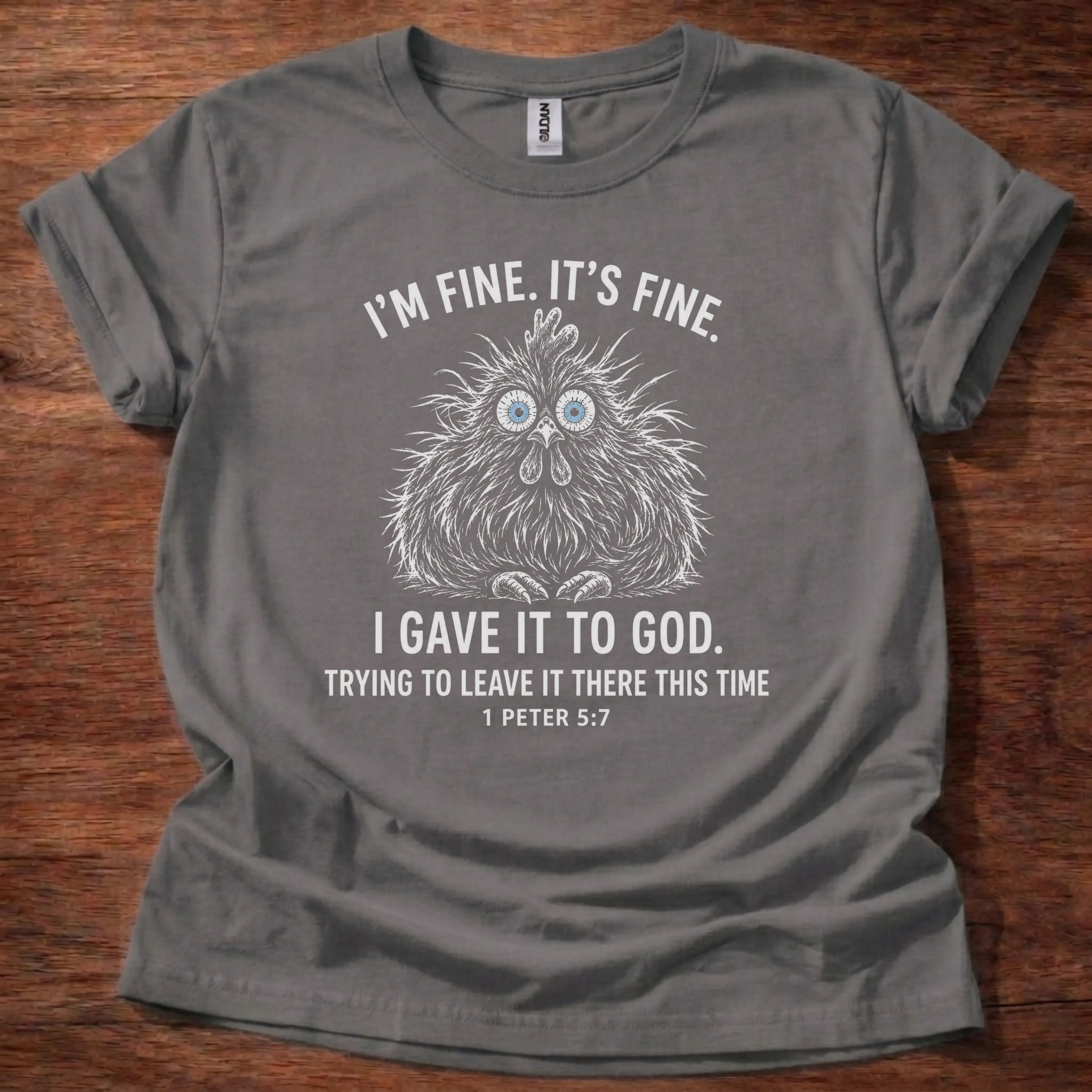 White fine-line chicken illustration t-shirt with the text 'I'm Fine. It's Fine. I Gave It To God. Trying To Leave It There This Time.' and 1 Peter 5:7