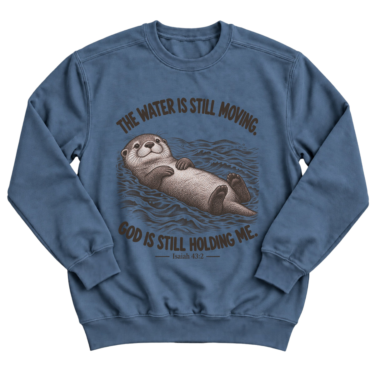 Indigo blue crewneck sweatshirt with an otter floating peacefully on rippling water and the words The Water Is Still Moving. God Is Still Holding Me. Isaiah 43:2
