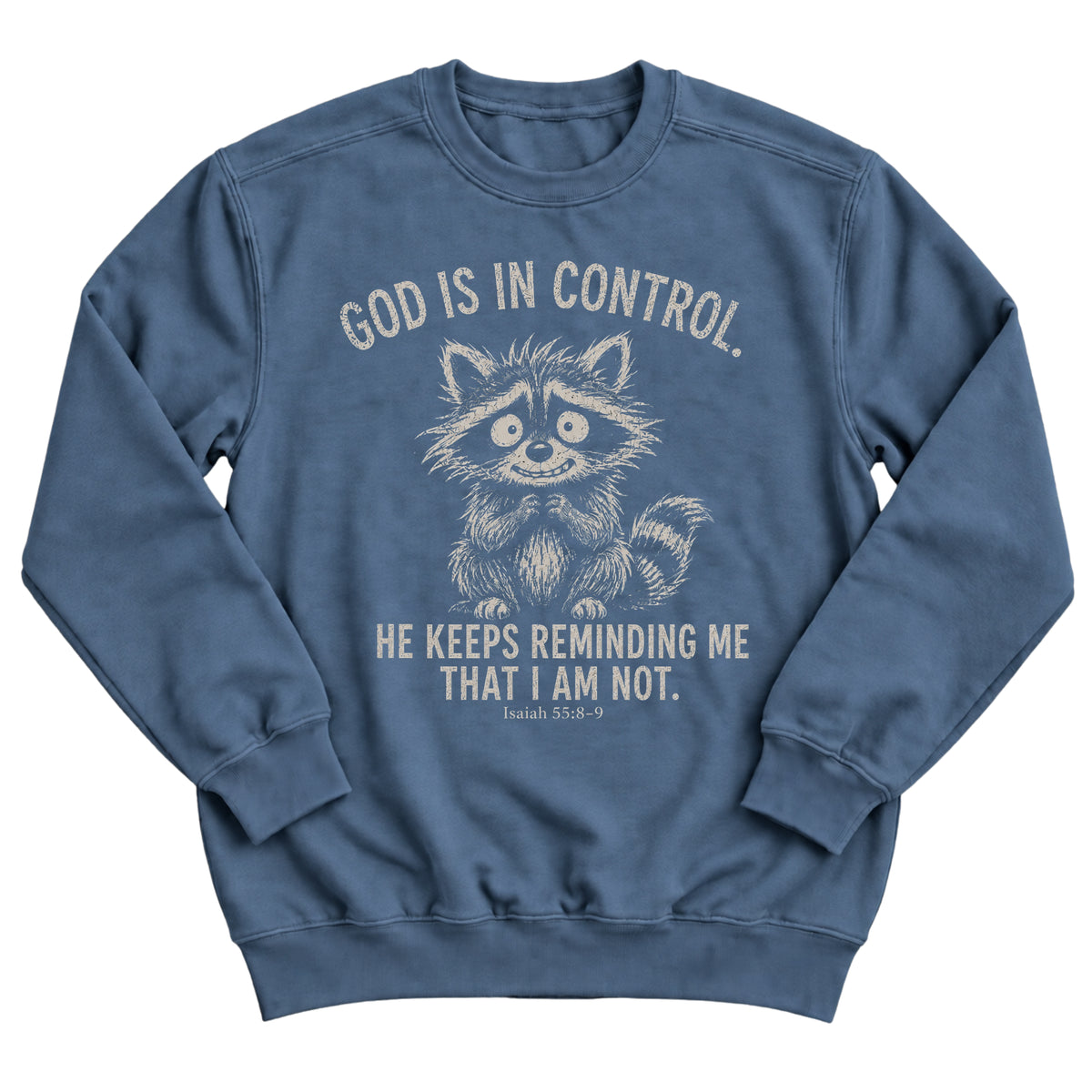 Indigo blue crewneck sweatshirt with a nervous, wide-eyed raccoon illustration and the words God Is In Control. He Keeps Reminding Me That I Am Not. Isaiah 55:8-9