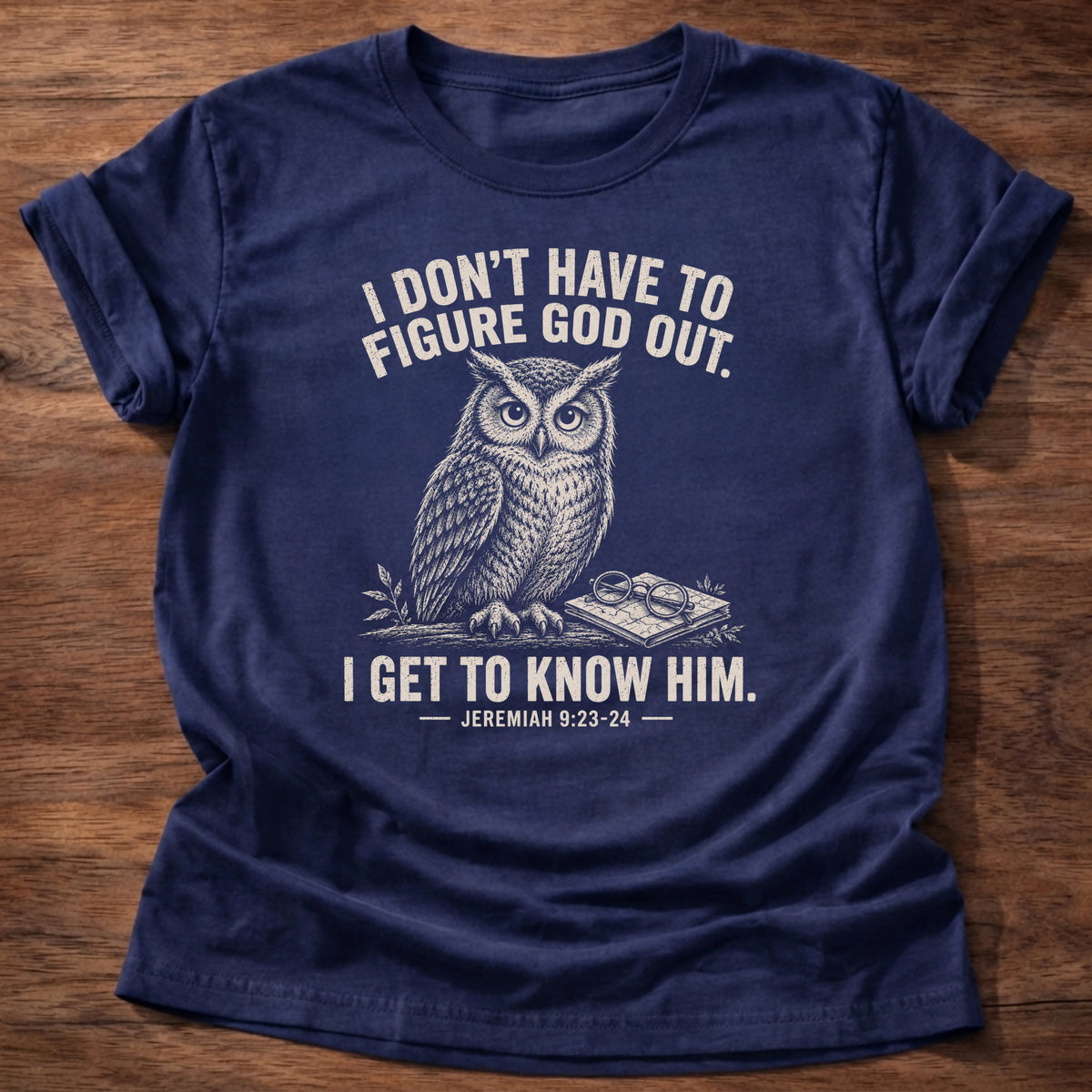 Navy t-shirt printed with owl graphic and 'I don't have to figure God out. I get to know Him,' a faith based gift