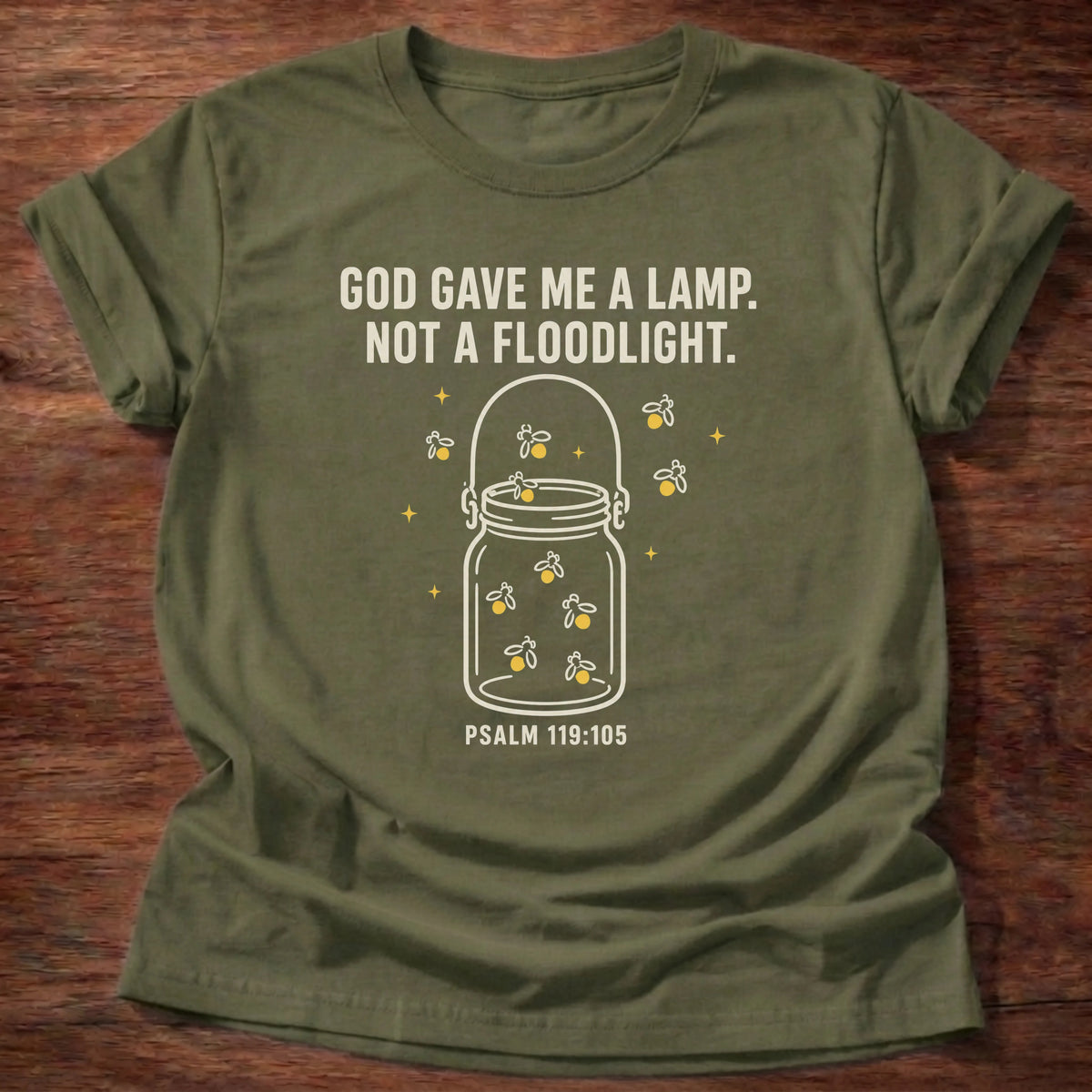 Military green t-shirt with glowing jar illustration reading 'God gave me a lamp, not a floodlight' Christian shirt