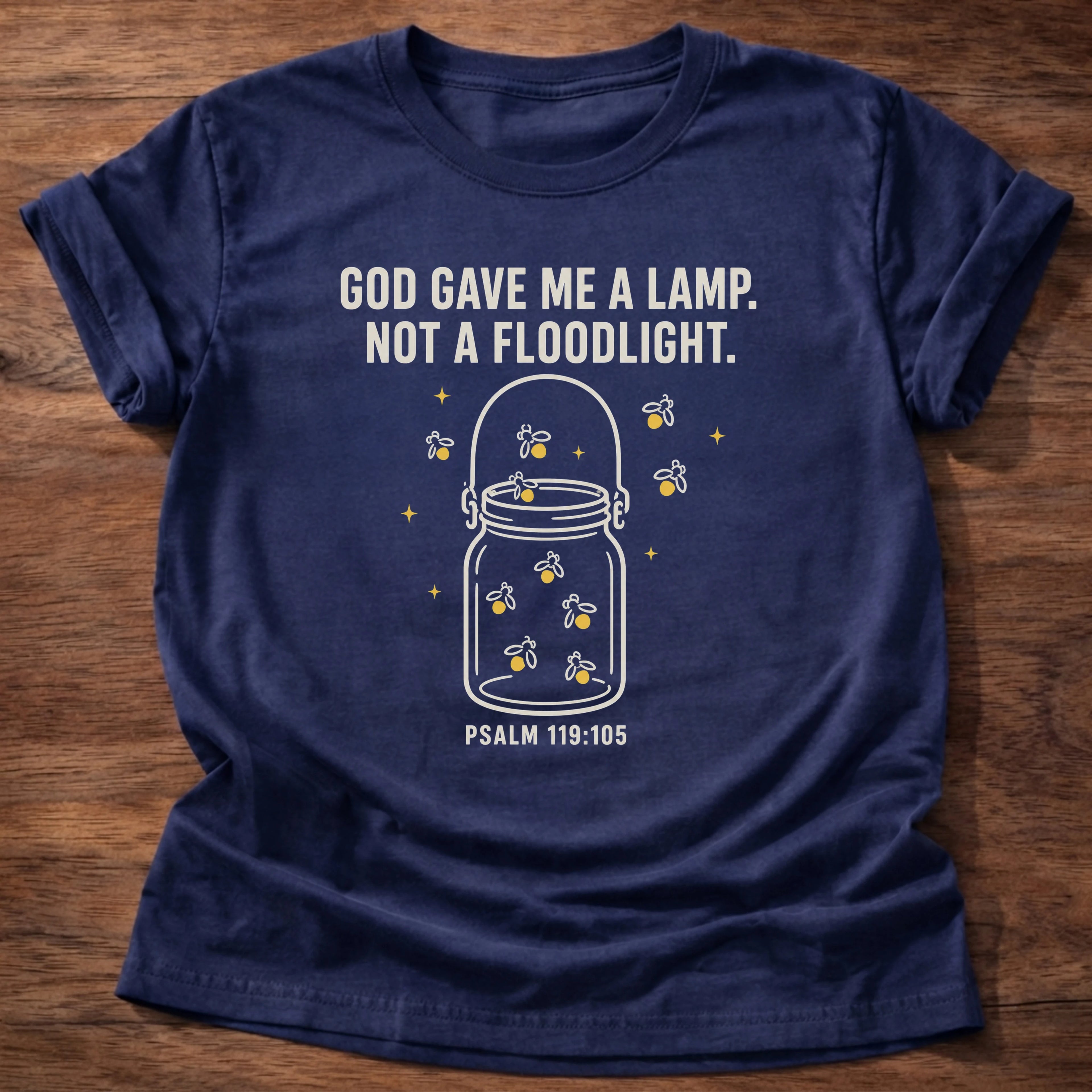 Navy t-shirt printed with 'God gave me a lamp, not a floodlight' jar of light graphic, Psalm 119:105 faith based tee