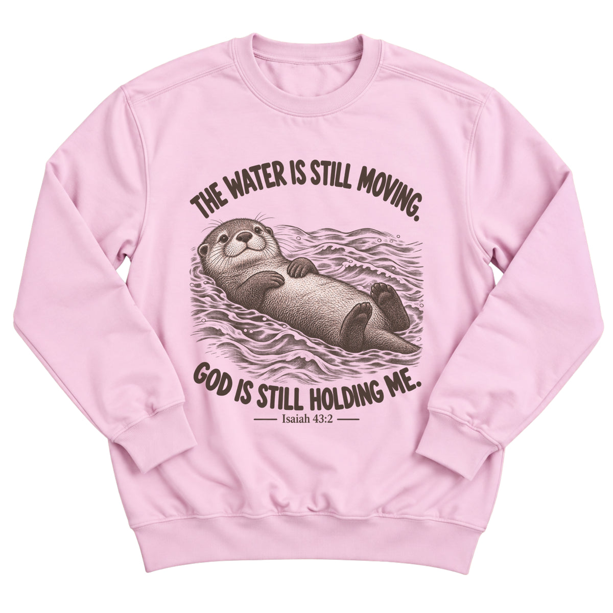 Light pink crewneck sweatshirt with an otter floating peacefully on rippling water and the words The Water Is Still Moving. God Is Still Holding Me. Isaiah 43:2