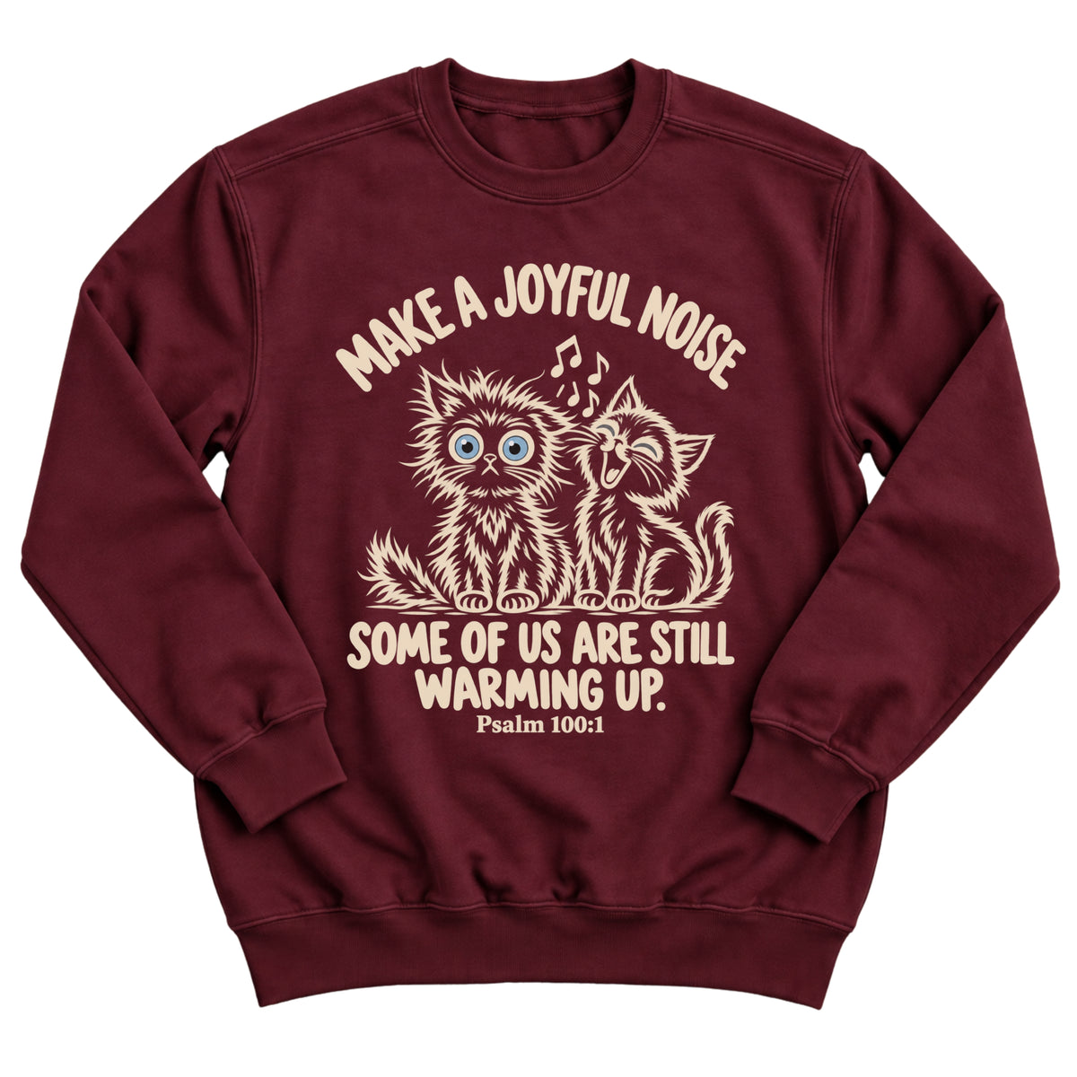 Maroon crewneck sweatshirt with two fluffy cats, one singing with music notes and one wide-eyed, with the words Make A Joyful Noise. Some Of Us Are Still Warming Up. Psalm 100:1