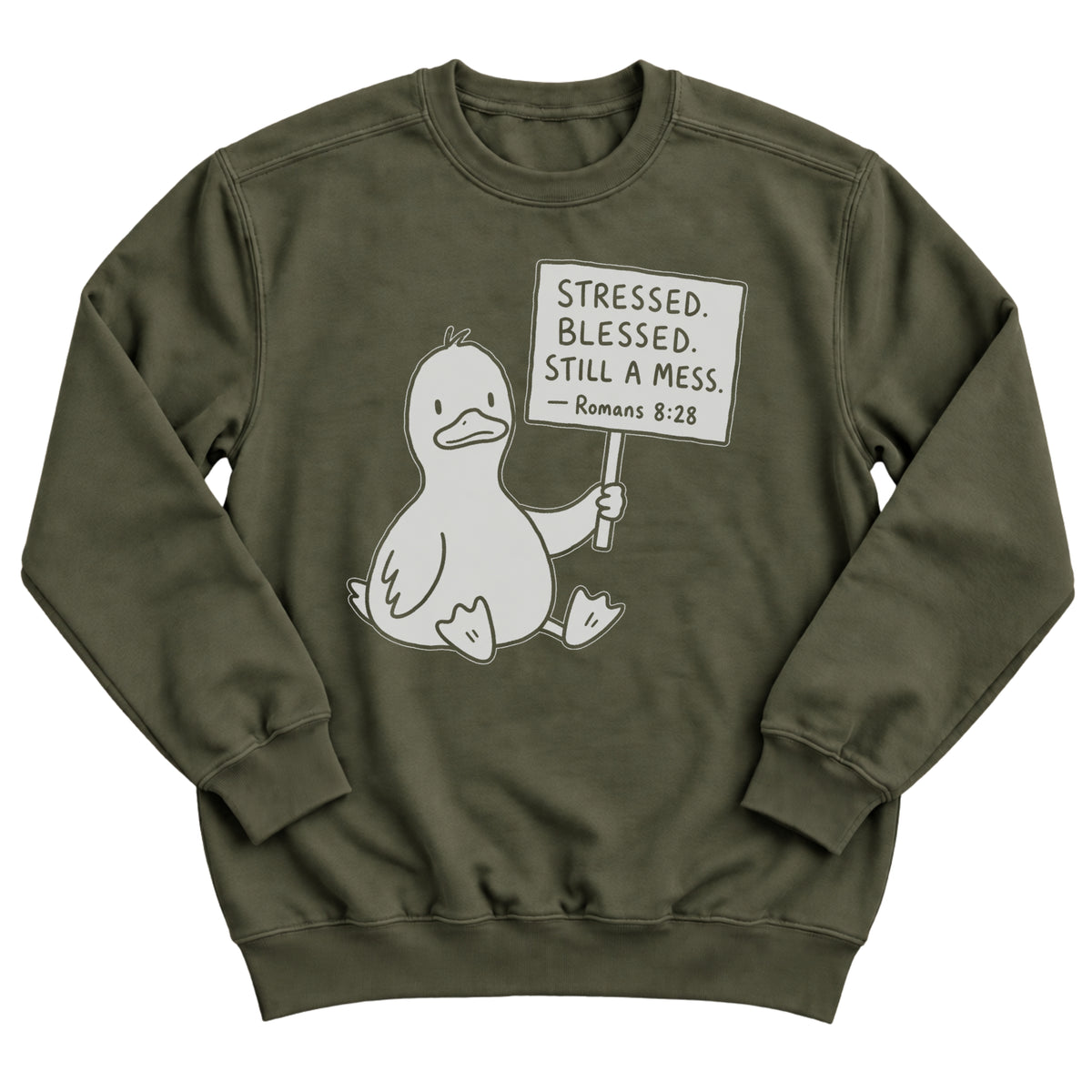 Military green crewneck sweatshirt with a cartoon duck sitting and holding a sign that reads Stressed. Blessed. Still A Mess. Romans 8:28