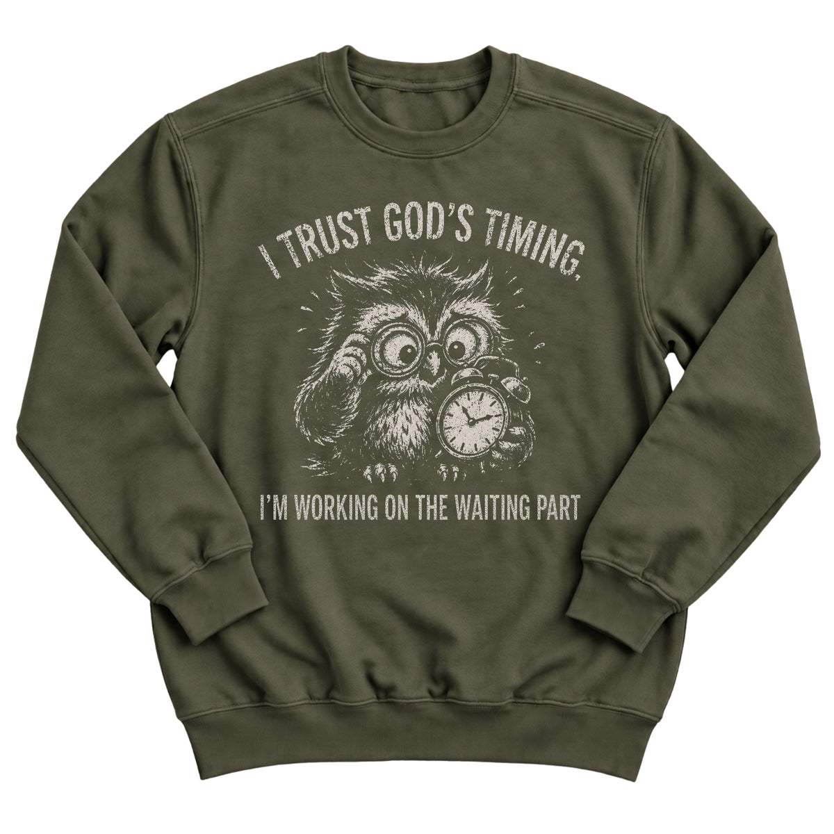 Military green crewneck sweatshirt with a frazzled owl in glasses clutching a clock and the words I Trust God's Timing. I'm Working On The Waiting Part.