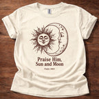 Natural t-shirt featuring a sun and moon celestial design with the text “Praise Him, Sun and Moon Psalm 148:3” printed on the front