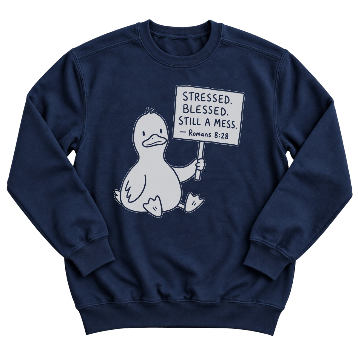 Navy crewneck sweatshirt with a cartoon duck sitting and holding a sign that reads Stressed. Blessed. Still A Mess. Romans 8:28
