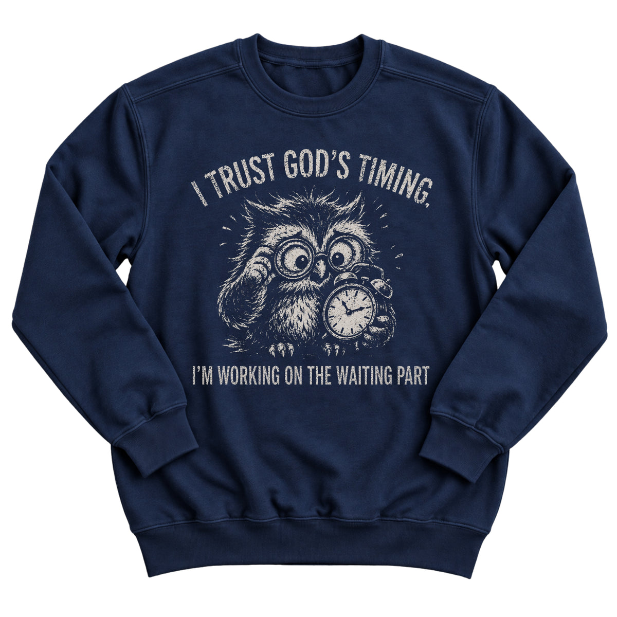 Navy crewneck sweatshirt with a frazzled owl in glasses clutching a clock and the words I Trust God's Timing. I'm Working On The Waiting Part.