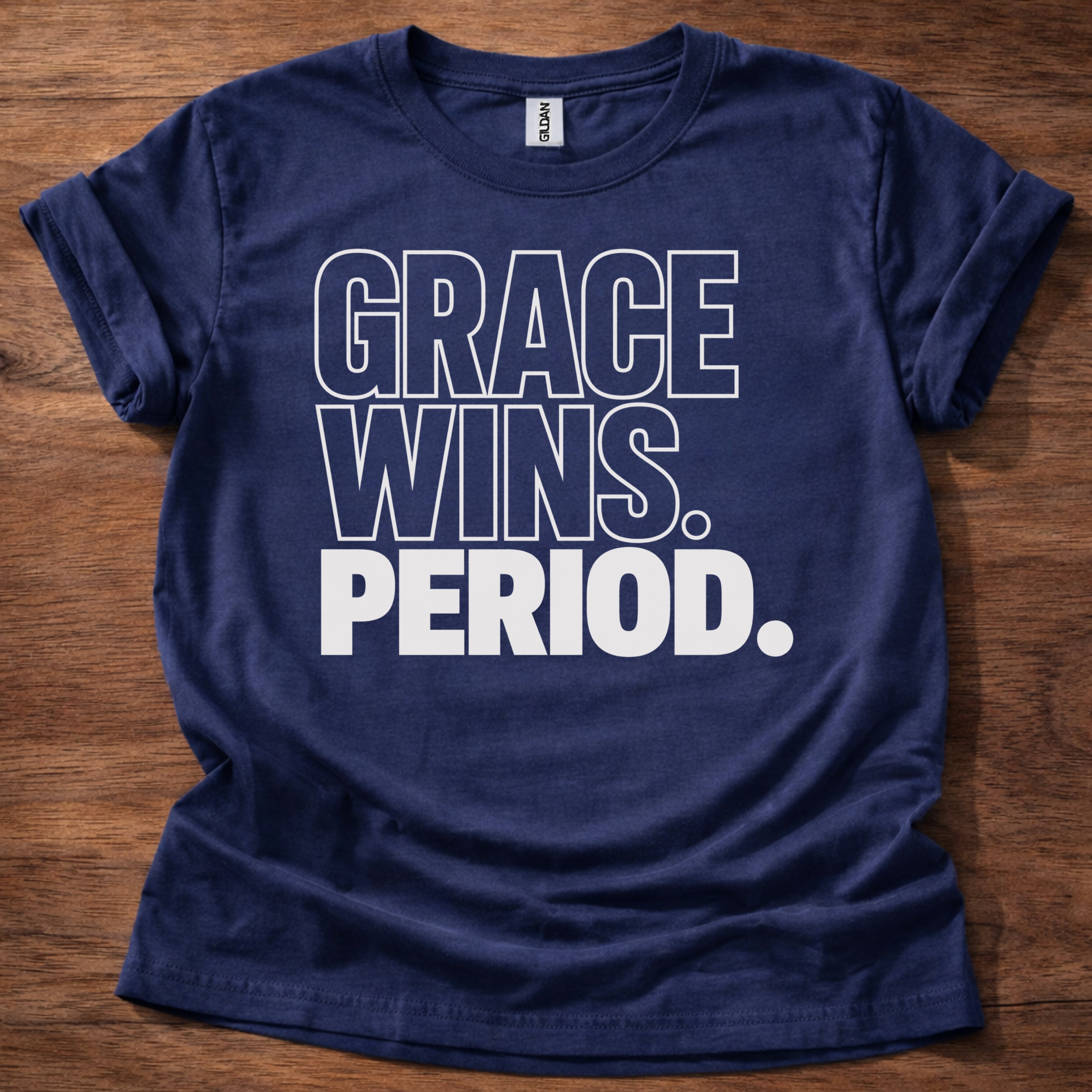 Navy Grace Wins Period Christian t-shirt with bold block lettering faith statement design