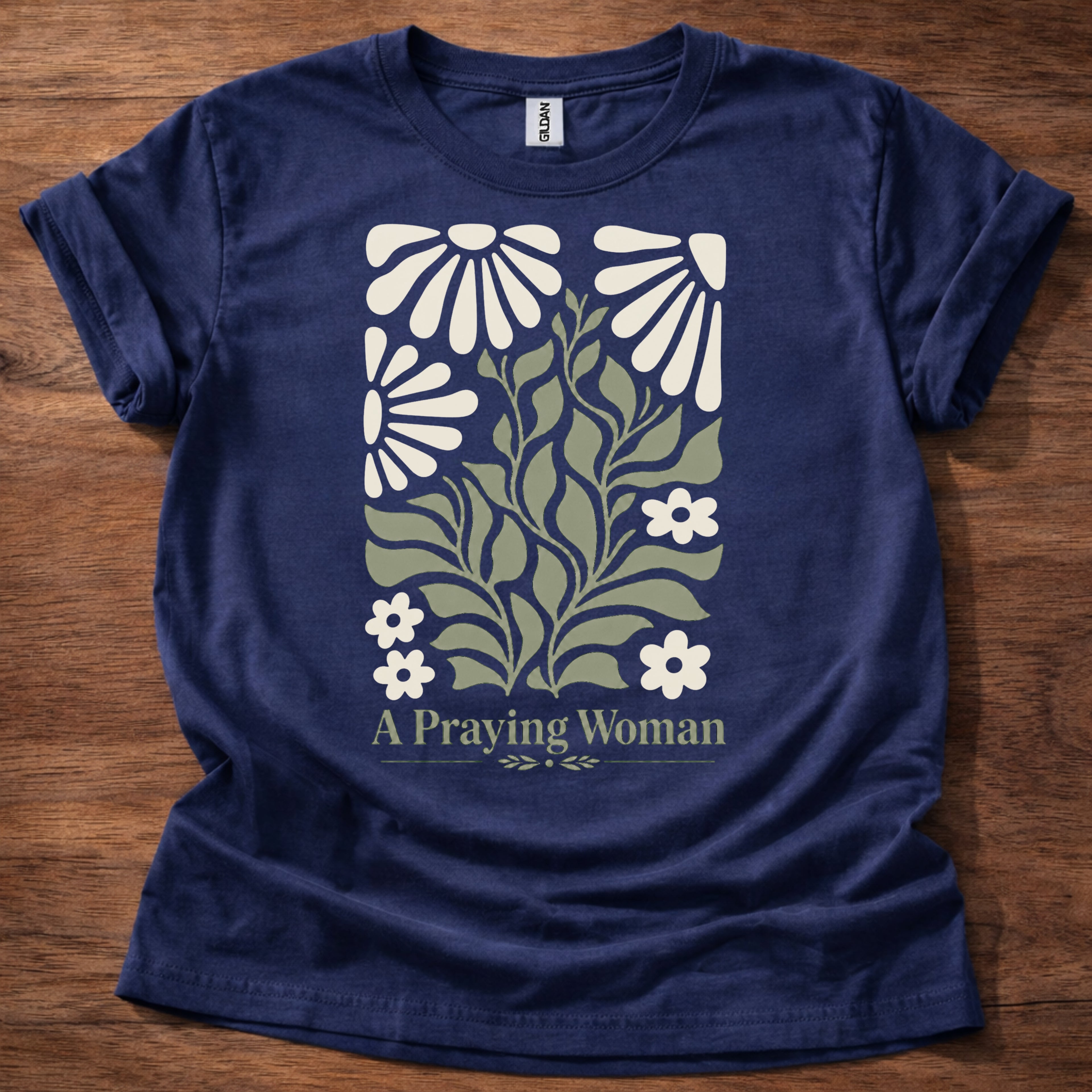 Navy blue t-shirt featuring a floral design with the phrase “A Praying Woman” printed on the front