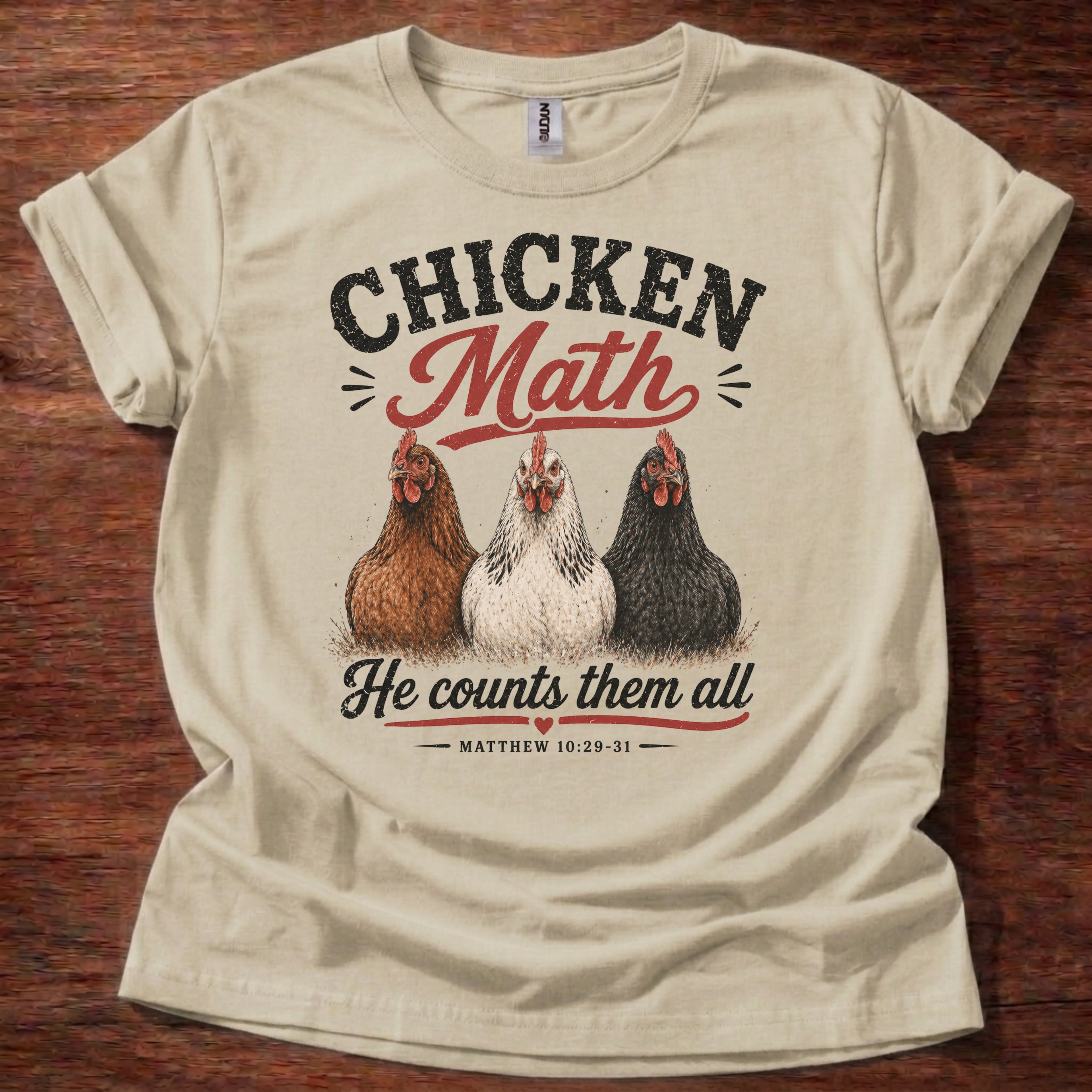 Sand Chicken Math He Counts Them All Christian chicken shirt with three hens graphic on beige t-shirt, Matthew 10:29-31 Bible verse design