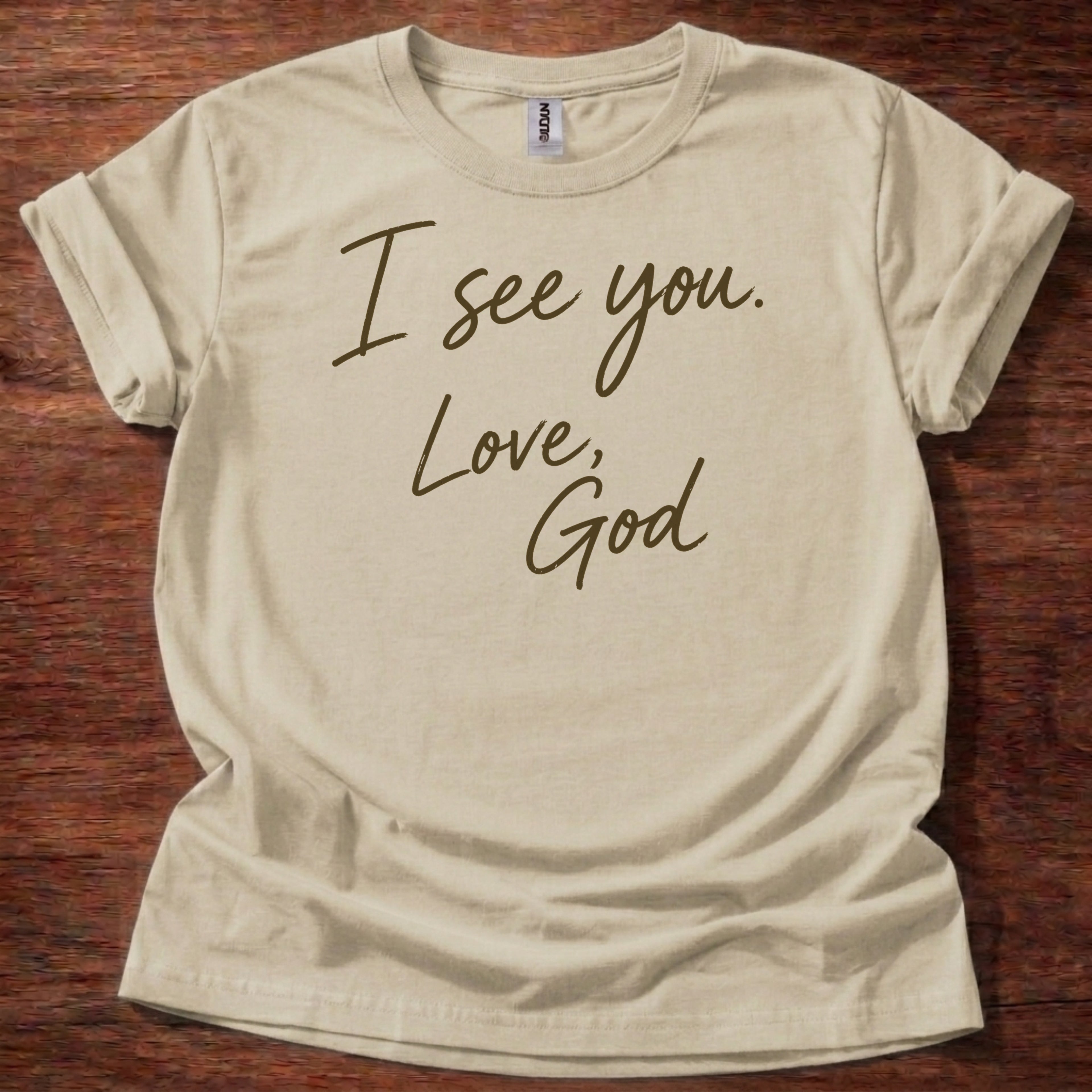 Sand Christian t-shirt with handwritten text reading I see you Love God