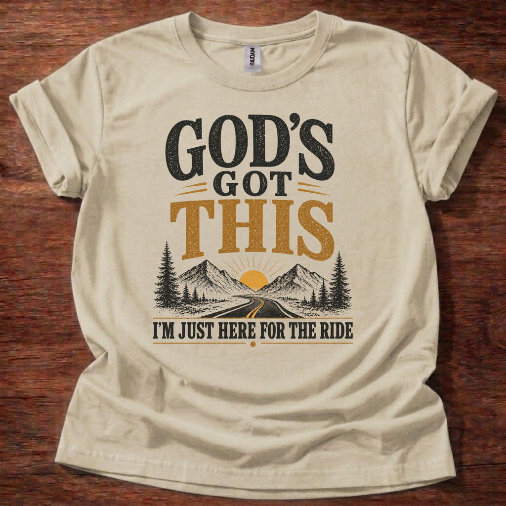 Sand God’s Got This I’m Just Here for the Ride Christian shirt with mountain and sunrise graphic on beige t-shirt, inspirational faith design