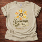Sand Growing Season Christian t-shirt with sunflower graphic and Philippians 1:6 scripture design