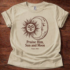 Sand t-shirt featuring a sun and moon celestial design with the text “Praise Him, Sun and Moon Psalm 148:3” printed on the front