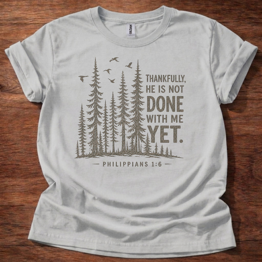 Sport Grey Christian t-shirt with forest graphic and “Thankfully, He is not done with me yet” Philippians 1:6 design