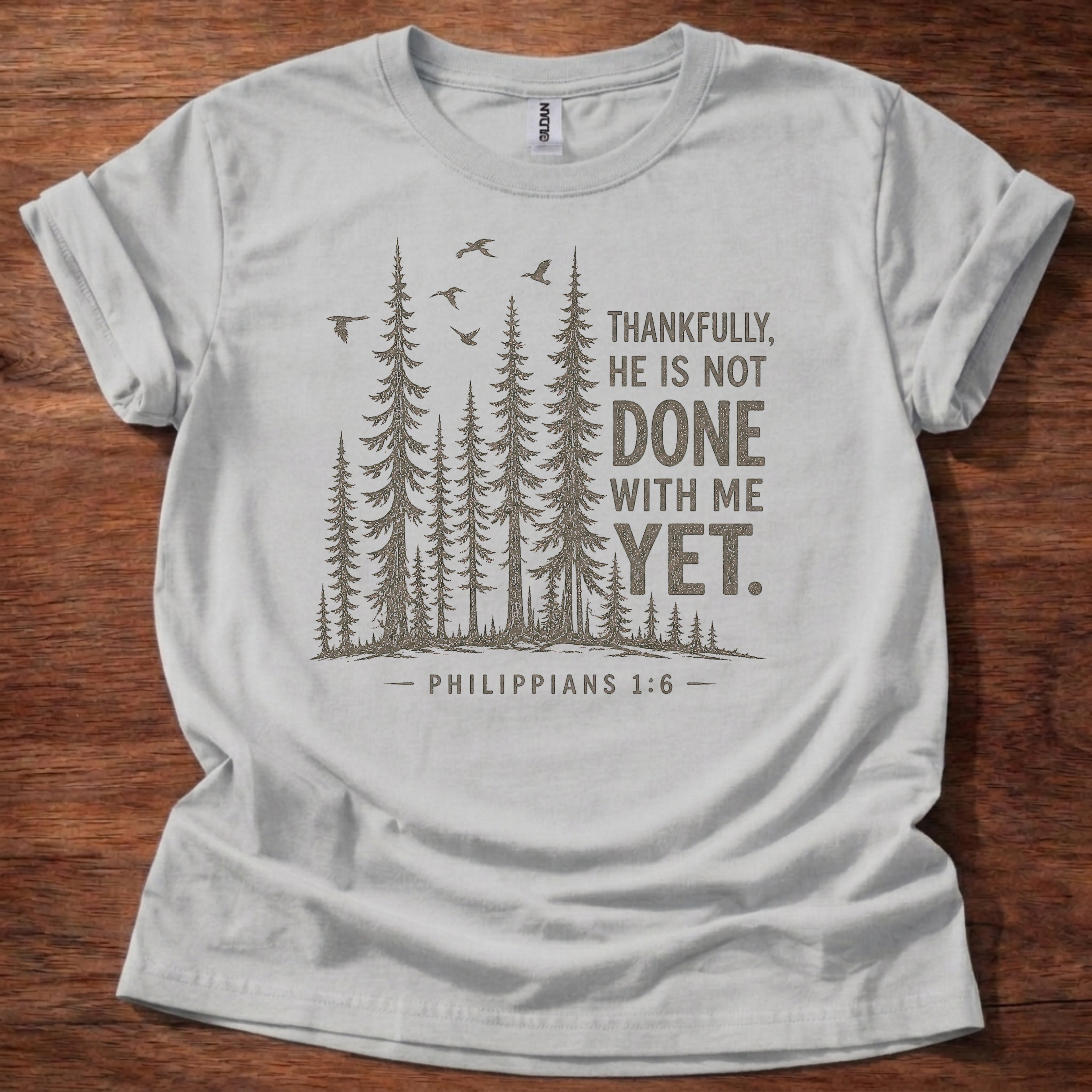 Sport Grey Christian t-shirt with forest graphic and “Thankfully, He is not done with me yet” Philippians 1:6 design