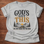Sport Grey God’s Got This I’m Just Here for the Ride Christian shirt with mountain and sunrise graphic on beige t-shirt, inspirational faith design