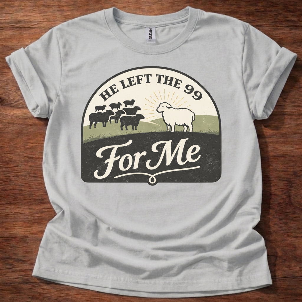 Gray t-shirt with a graphic design featuring sheep and text on a wooden surface
