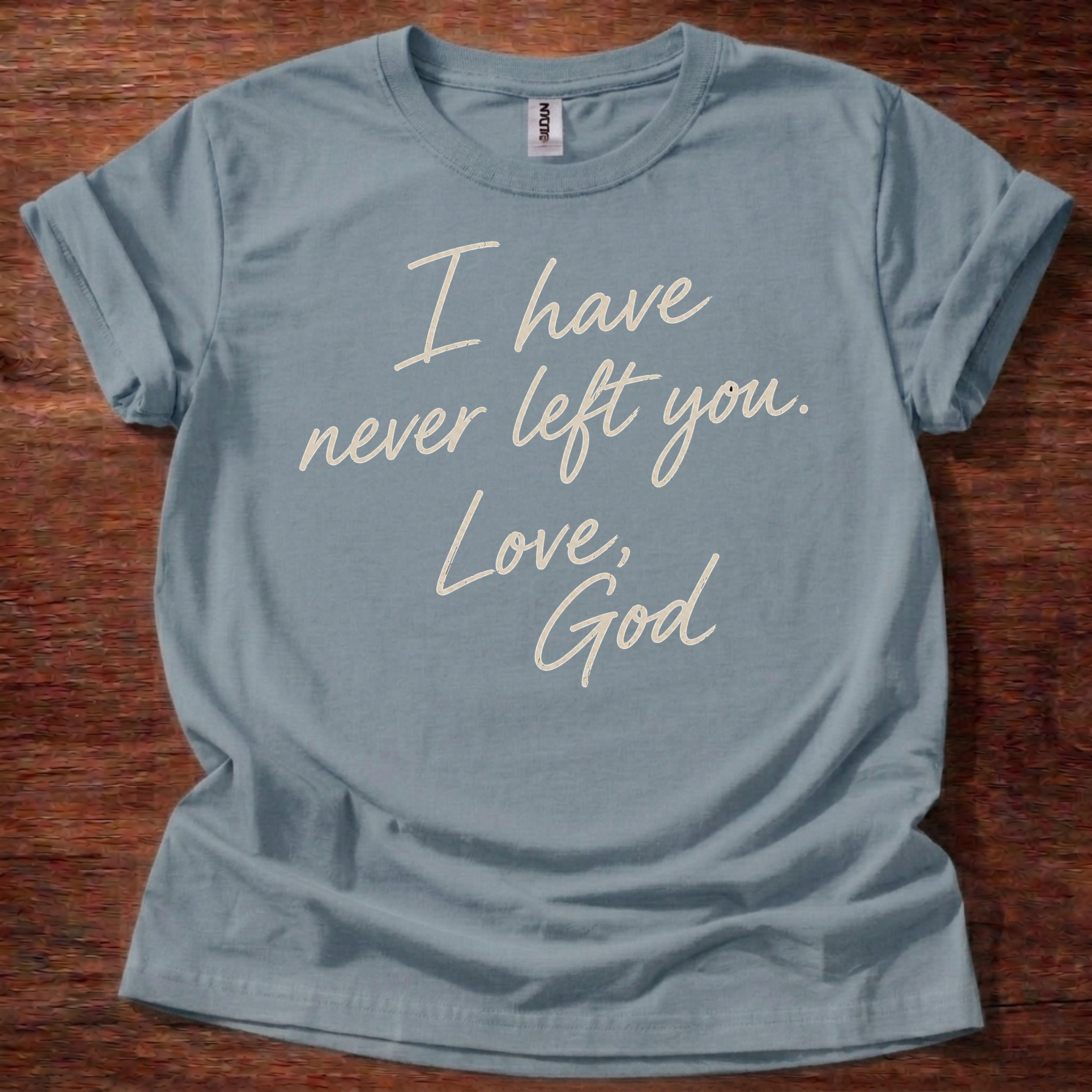 Stone Blue Christian t-shirt with handwritten text reading I have never left you Love God