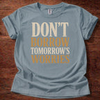 Stone Blue Don’t Borrow Tomorrow’s Worries Christian shirt with bold vintage typography design on navy background, Matthew 6:34 inspired faith tee
