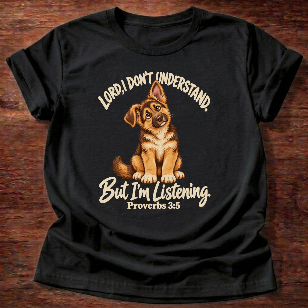 Black t-shirt printed with a German shepherd puppy tilting its head and “Lord, I don't understand. But I'm listening.” Proverbs 3:5 Christian shirt