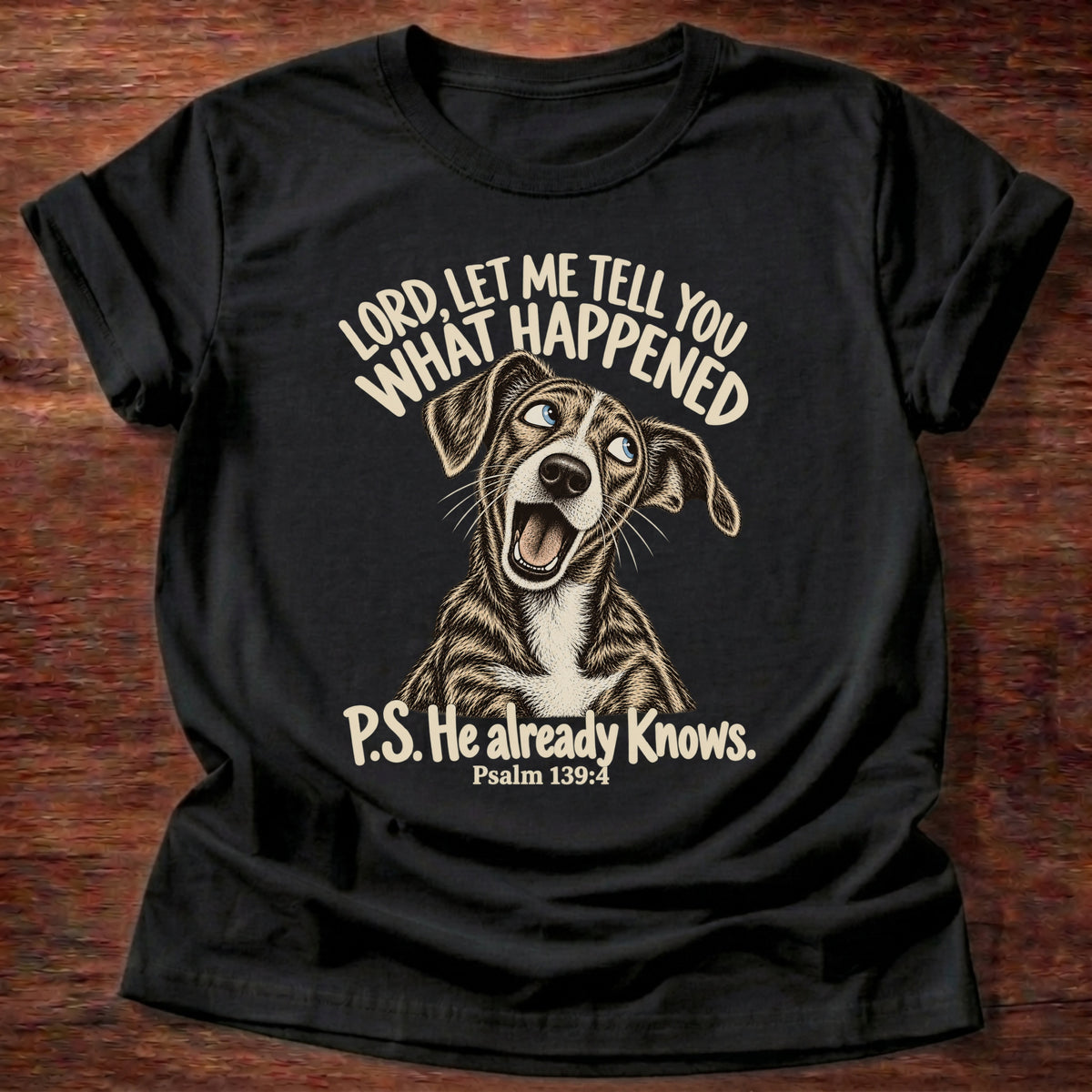 Black t-shirt printed with a wide-eyed storytelling dog graphic and “Lord, let me tell you what happened. P.S. He already knows.” Psalm 139:4 Christian shirt
