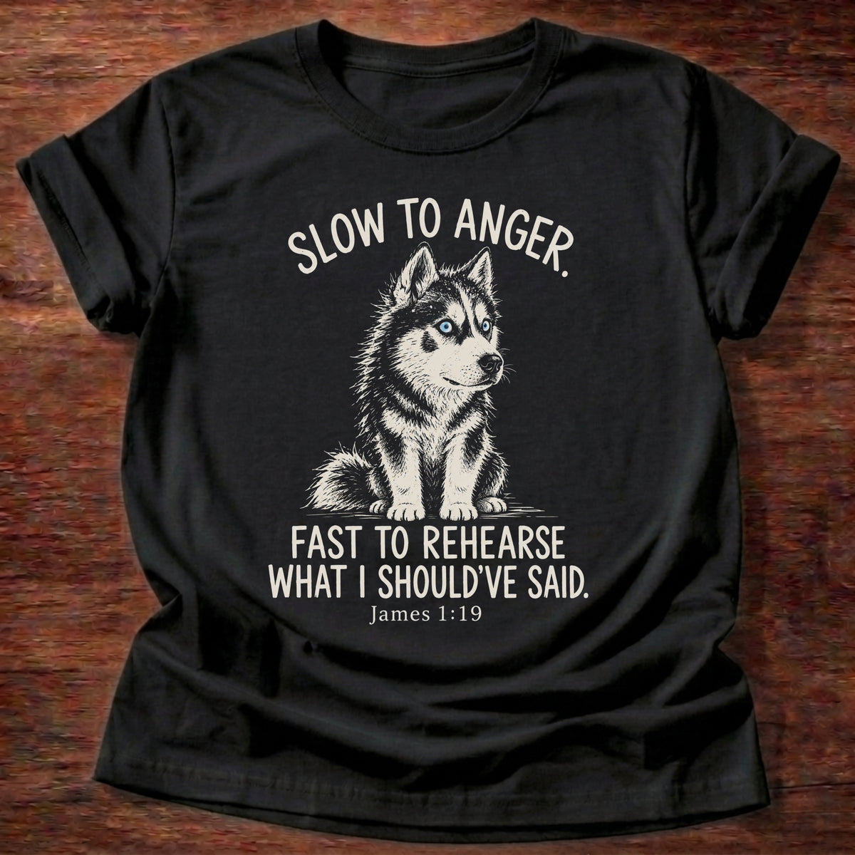 Slow To Anger T-Shirt in Black featuring a blue-eyed husky puppy sitting calmly and James 1:19 patience humor design