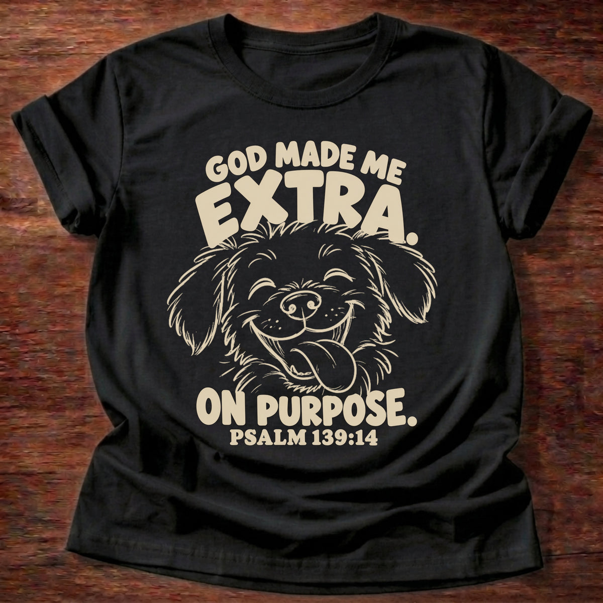 Black t-shirt printed with a fluffy, happy dog with its tongue out and “God made me extra. On purpose.” Psalm 139:14 Christian shirt