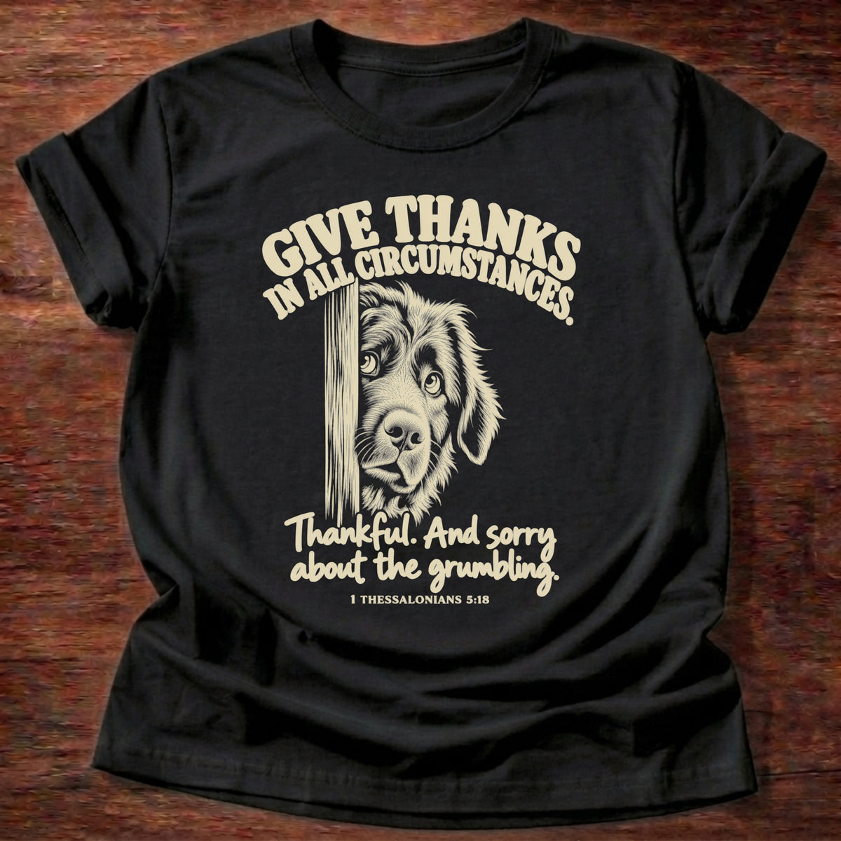 Grumbling T-Shirt in Black featuring a fluffy dog peeking around a door and 1 Thessalonians 5:18 gratitude humor design