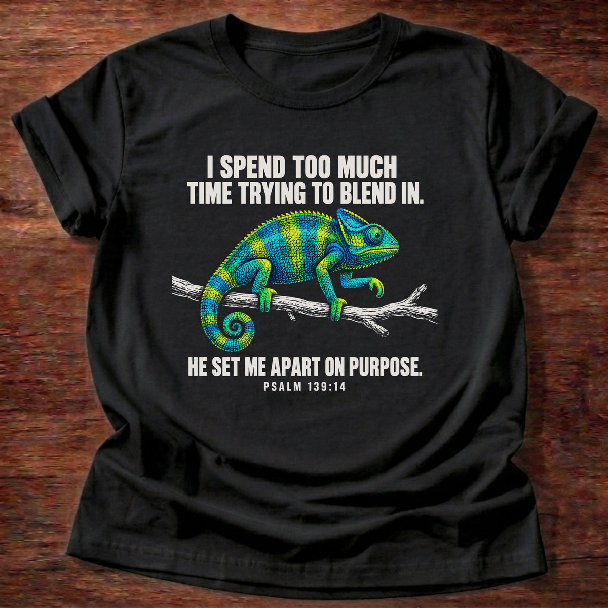 Black t-shirt printed with a chameleon blending into a branch graphic and 'I spend too much time trying to blend in. He set me apart on purpose.' Psalm 139:14 faith based gift