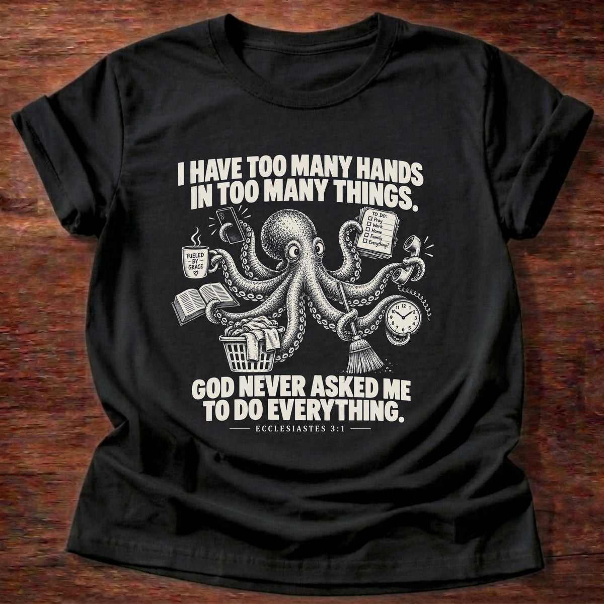 Black t-shirt printed with an octopus juggling a mug, book, broom, and clock graphic and 'I have too many hands in too many things. God never asked me to do everything.' Ecclesiastes 3:1 faith based gift