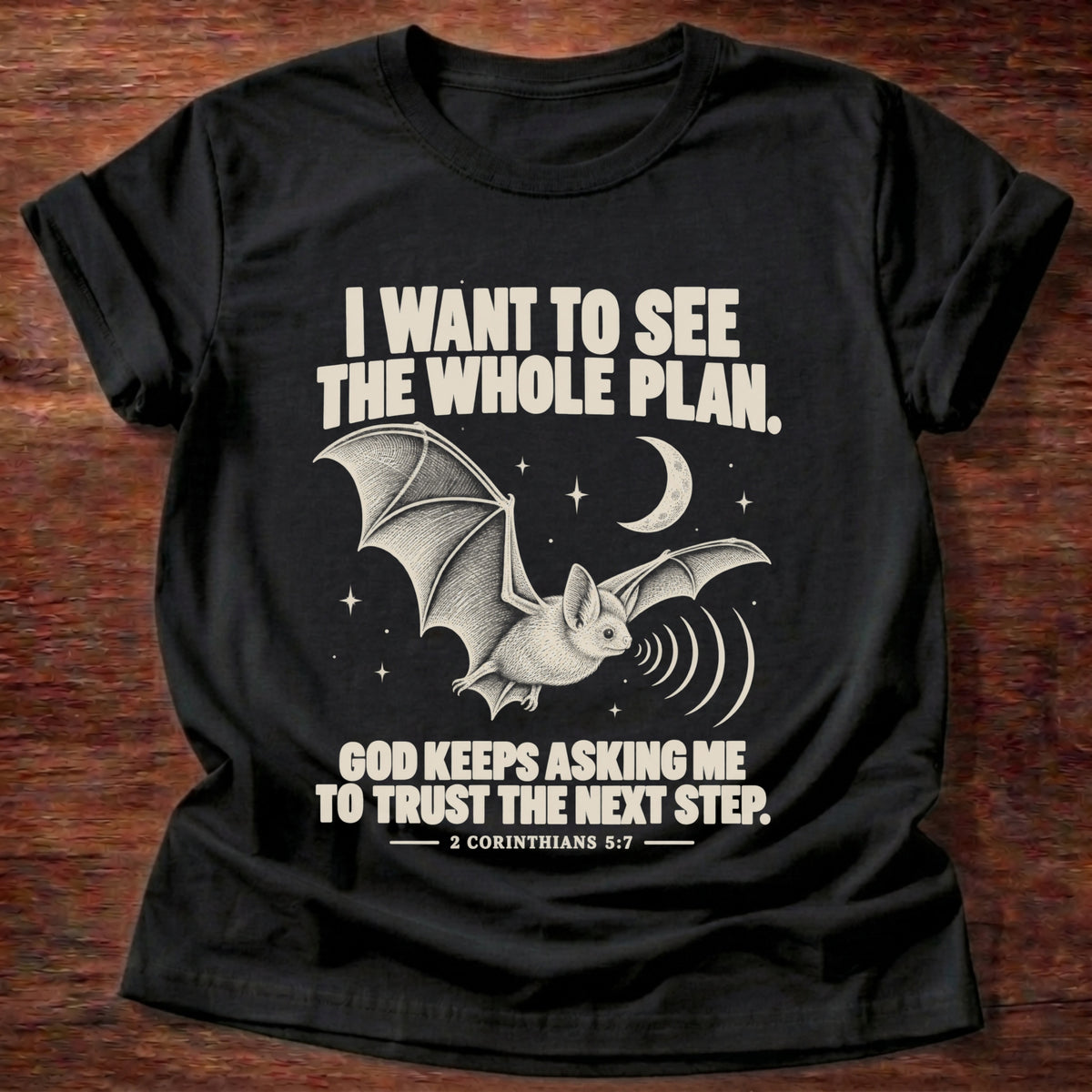 Black t-shirt printed with a bat flying under a night sky graphic and 'I want to see the whole plan. God keeps asking me to trust the next step.' 2 Corinthians 5:7 faith based gift