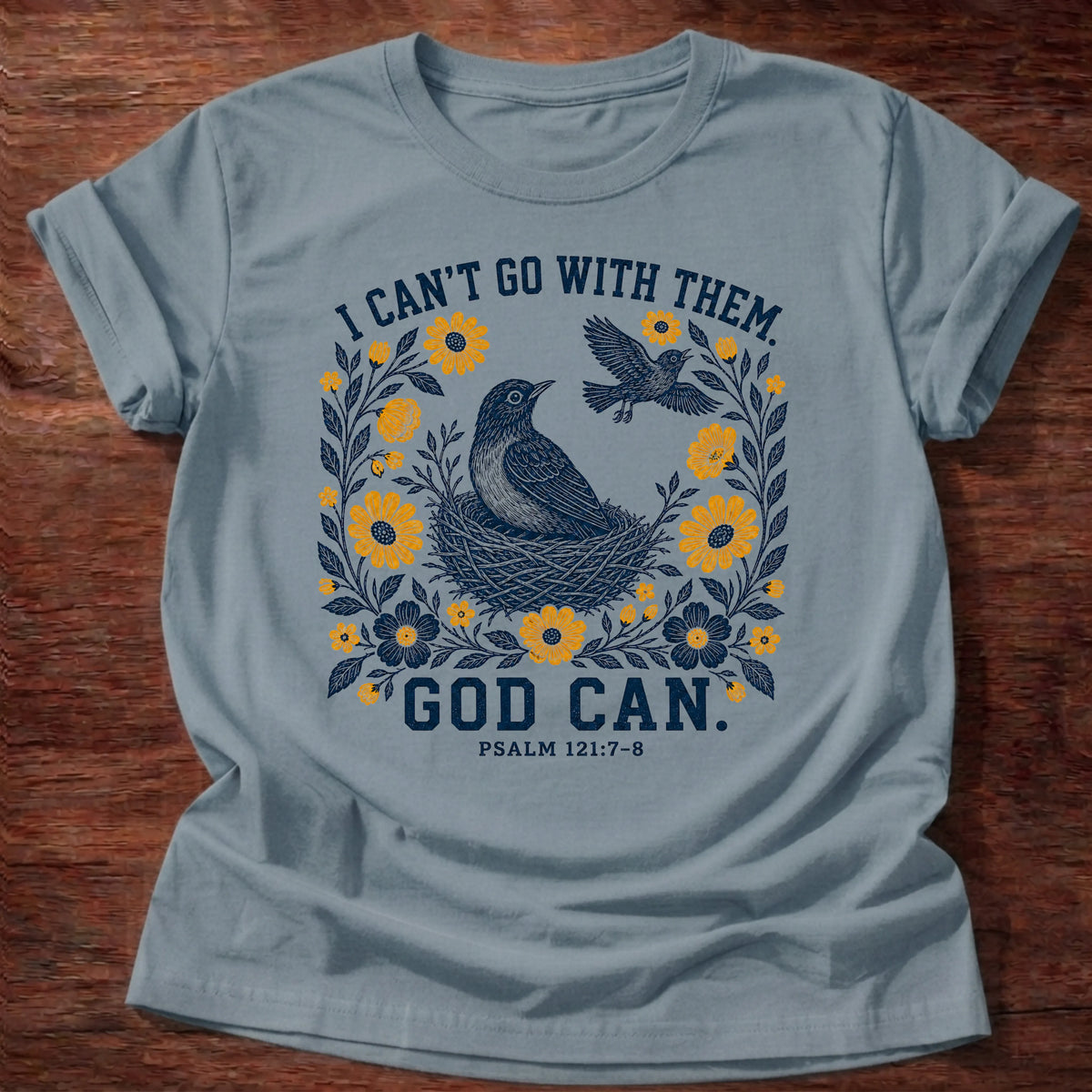 Stone Blue Gildan 64000 t-shirt with a bird and nest illustration and 'I Can't Go With Them, God Can' text, Psalm 121:7-8 Christian t-shirt
